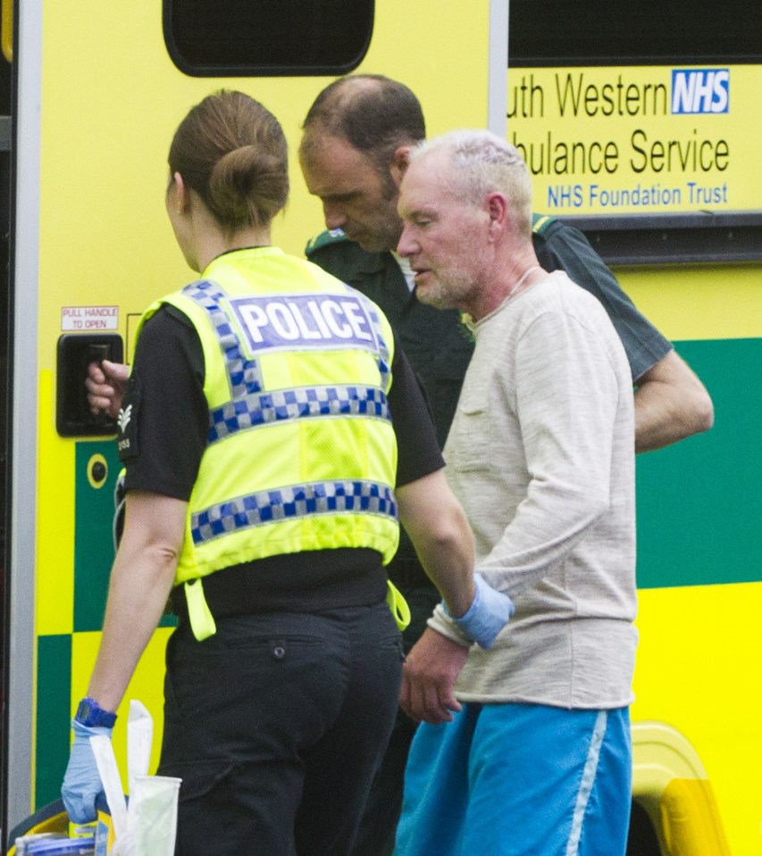  Bare feet with a cut to the head ... Gazza is helped into ambulance