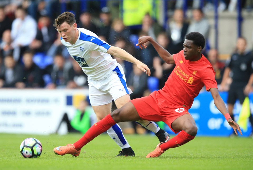 Tranmere Rovers Connor Jennings (left) and Liverpool's Ovie Ejaria battle for the ball during the pre-season match at Prenton Park, Birkenhead. PRESS ASSOCIATION Photo. Picture date: Friday July 8, 2016. See PA story SOCCER Tranmere. Photo credit should read: Nigel French/PA Wire. RESTRICTIONS: EDITORIAL USE ONLY. No use with unauthorised audio, video, data, fixture lists, club/league logos or "live" services. Online in-match use limited to 45 images, no video emulation. No use in betting, games or single club/league/player publications