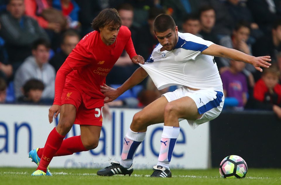 BIRKENHEAD, ENGLAND - JULY 08: Lazar Markovic of Liverpool pulls the shirt of Evan Gumbs of Tranmere Rovers during the Pre-Season Friendly match between Tranmere Rovers and Liverpool at Prenton Park on July 8, 2016 in Birkenhead, England. (Photo by Dave Thompson/Getty Images)