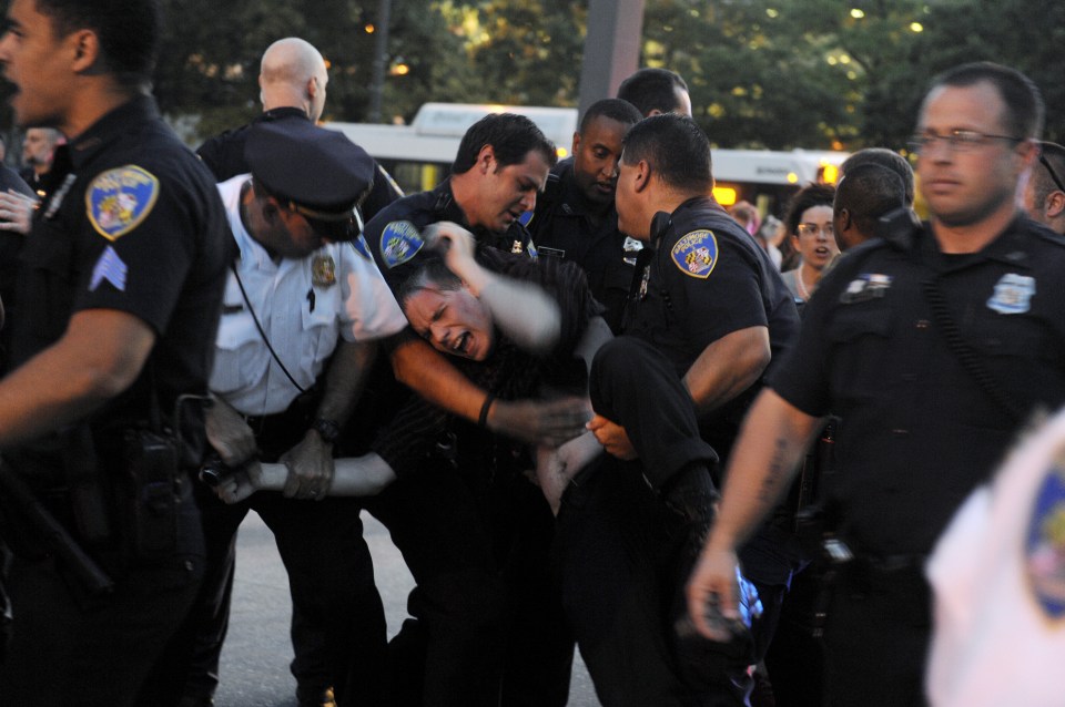  Police arrest a man in Baltimore during demonstrations on Friday