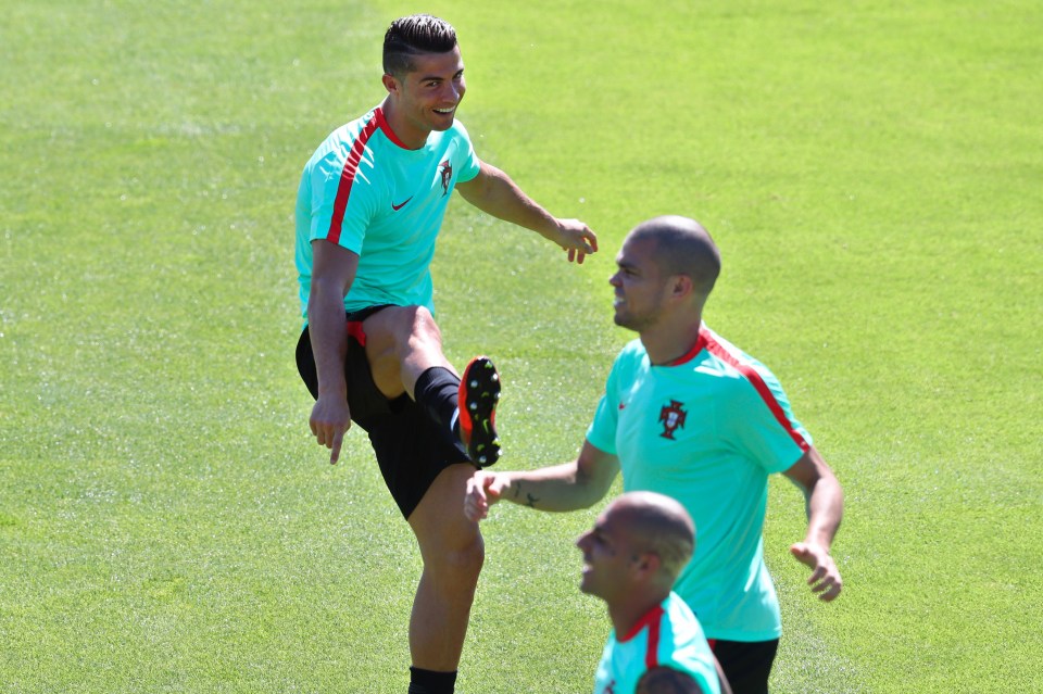  Cristiano Ronaldo smirks at Ricardo Quaresma's haircut for the Euro final