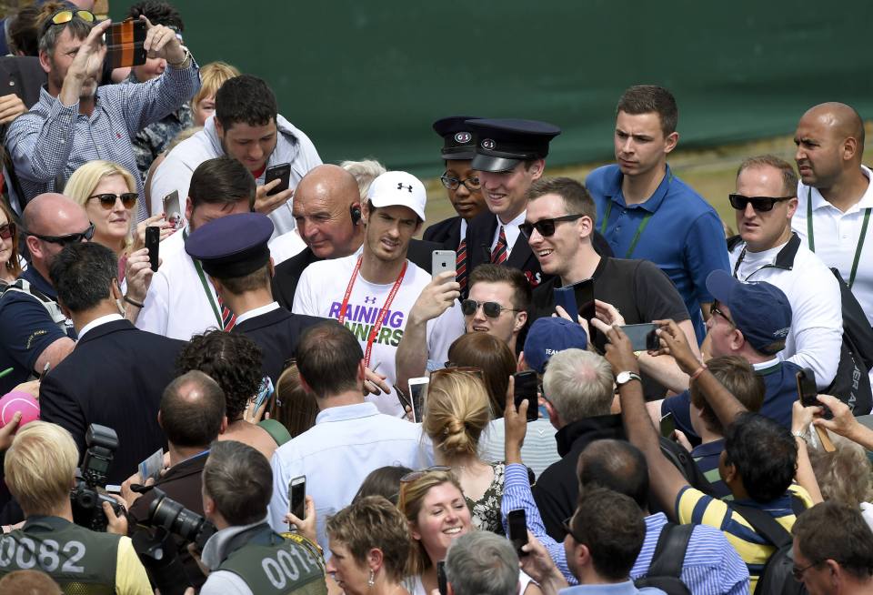  Andy Murray poses with fans during a practrice session ahead of his big day against Raonic at SW19