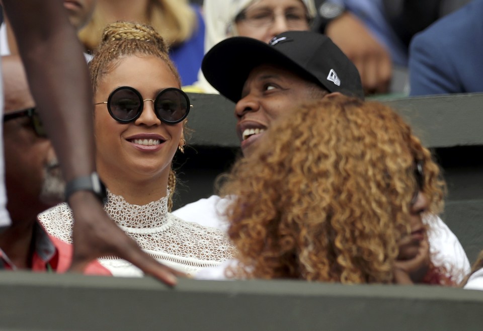  Rapper Jay Z kept his superstar wife close as they watch today's events unfold at Wimbledon