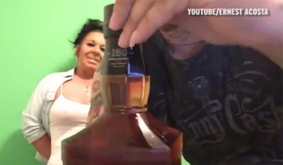  Ernest shows the bottle's unopened seal to the camera