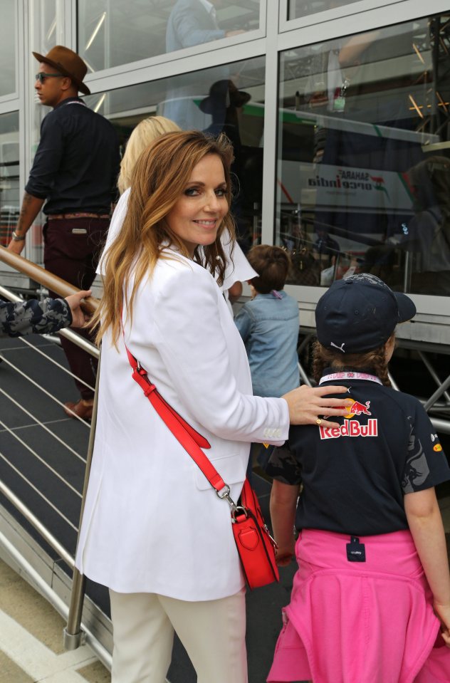  Geri looked pretty in a simple white jacket and beige trousers