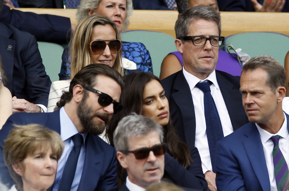  Hugh Grant and a female pal sat behind Bradley Cooper