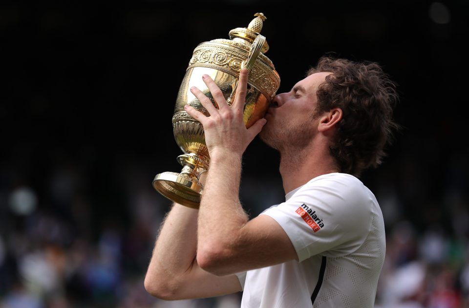  World No2 Andy Murray kisses his trophy after a famous Wimbledon triumph