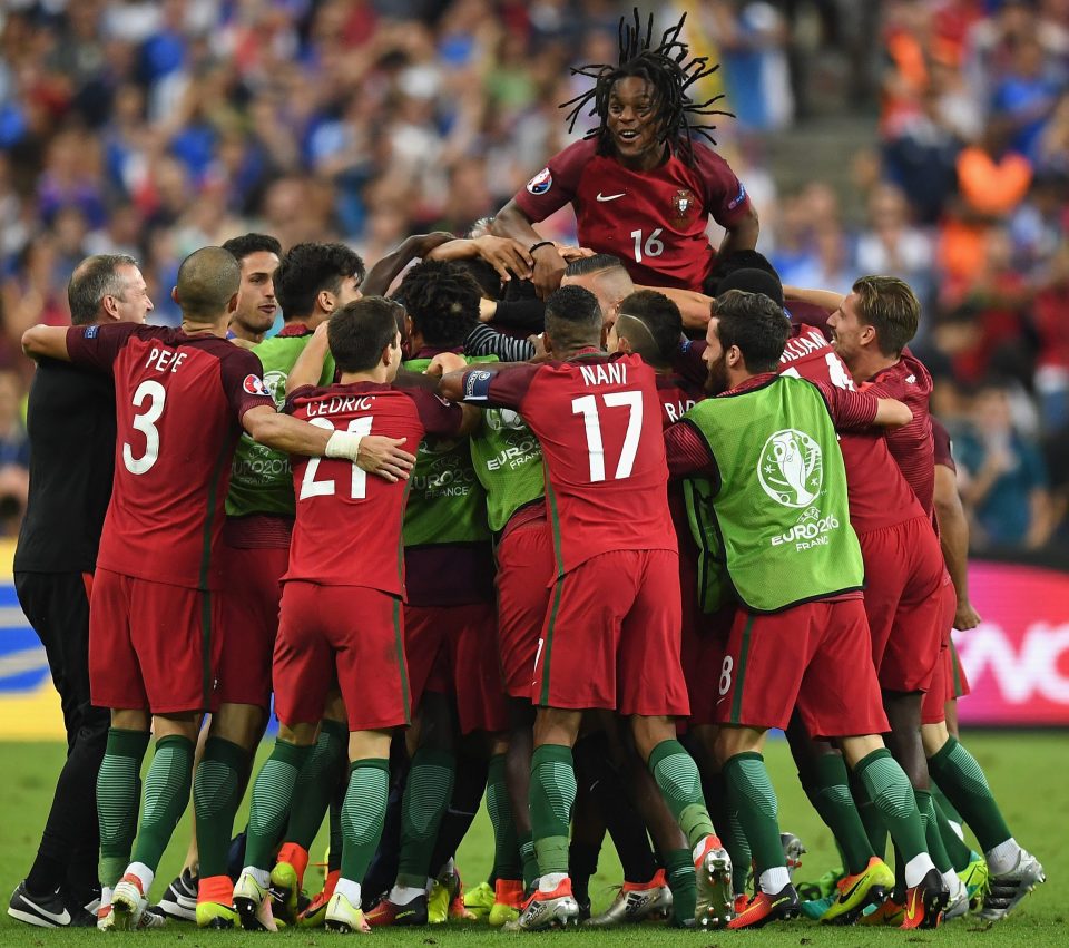 The Portugal squad mob goal hero Eder after his extra-time strike opened the scoring against France