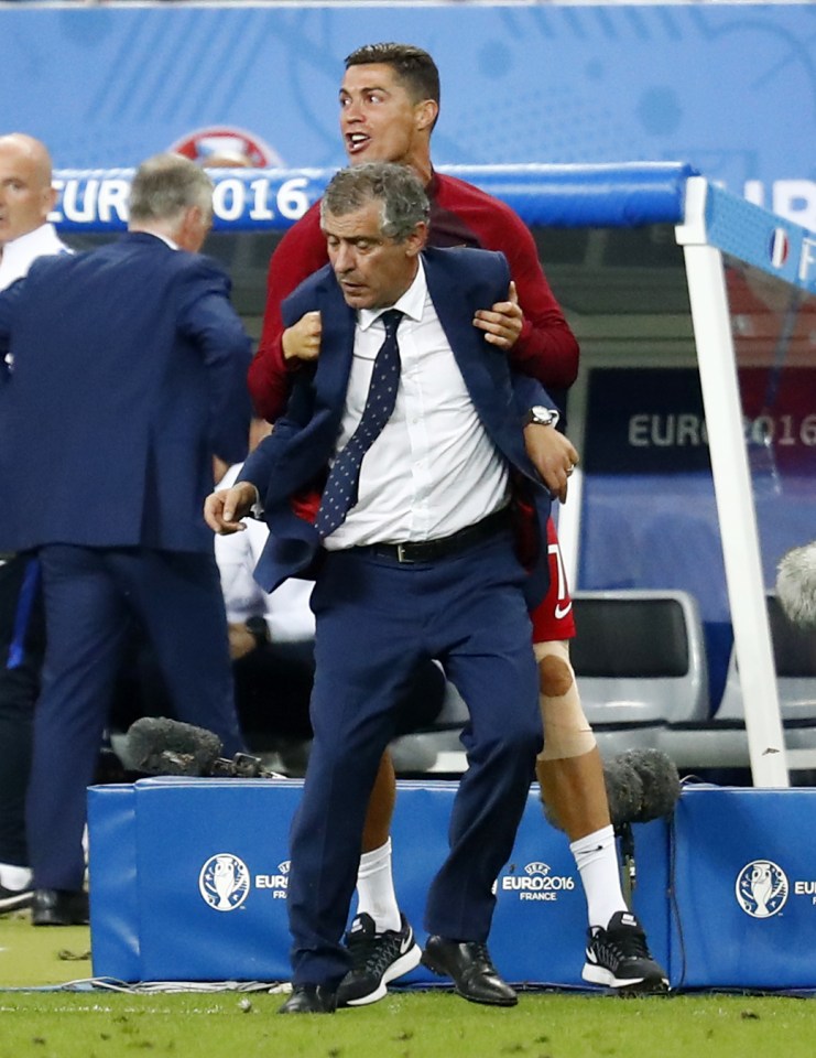 Cristiano Ronaldo celebrates with Portugal coach Fernando Santos as the country seal Euro 2016 glory over France