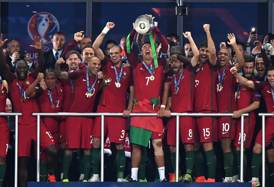 Cristiano Ronaldo lifts the European Championship trophy aloft as Portugal are crowned champions following their victory over France