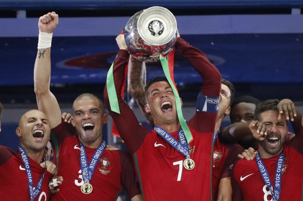 Portugal captain Cristiano Ronaldo lifts the cup after his team-mates win in the final