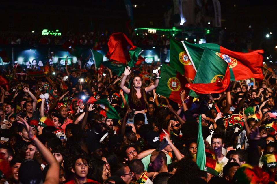 Portuguese fans in their own capital city celebrate after their team's victory in Paris