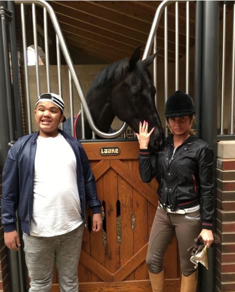  She encourages her kids, including eldest son Harvey, to spend time with the horses