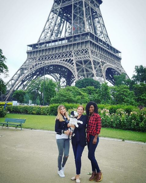  Sam posted this picture of her friends and pet dog Miley in front of the Eiffel Tower on trip to support boyfriend Chris in Euros