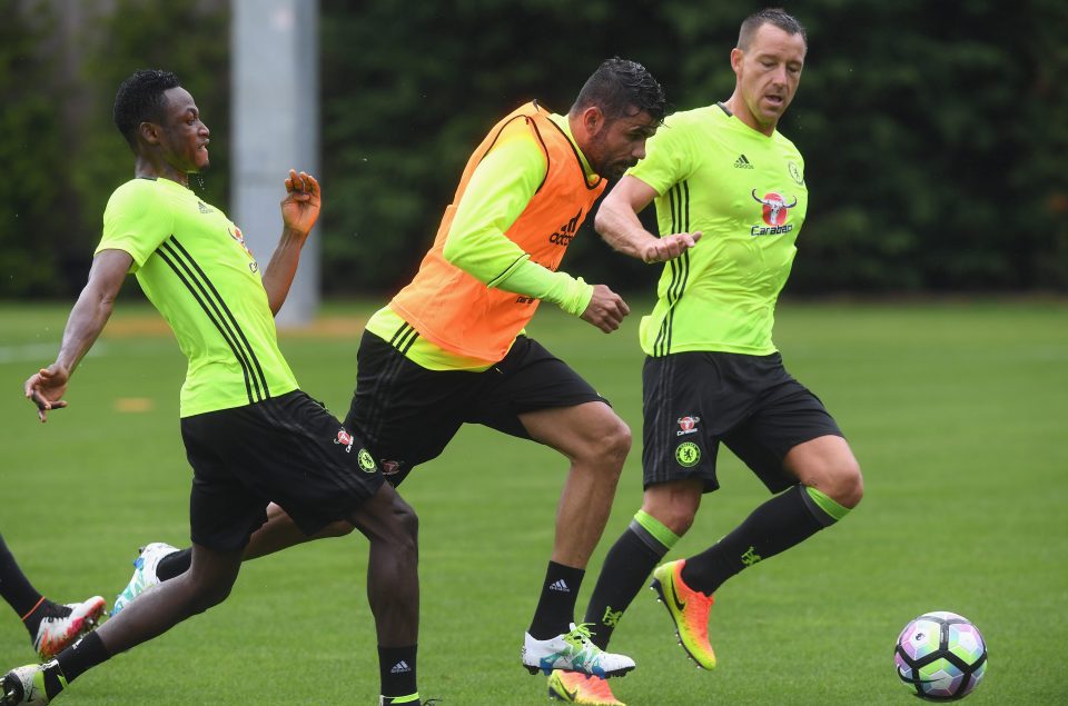  Diego Costa powers between Baba Rahman and John Terry as Chelsea limber up