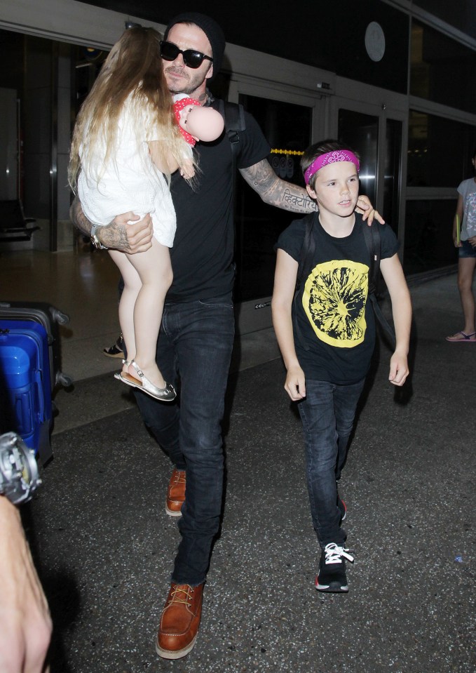 David Beckham and Kids arriving at the Los Angeles International Airport.