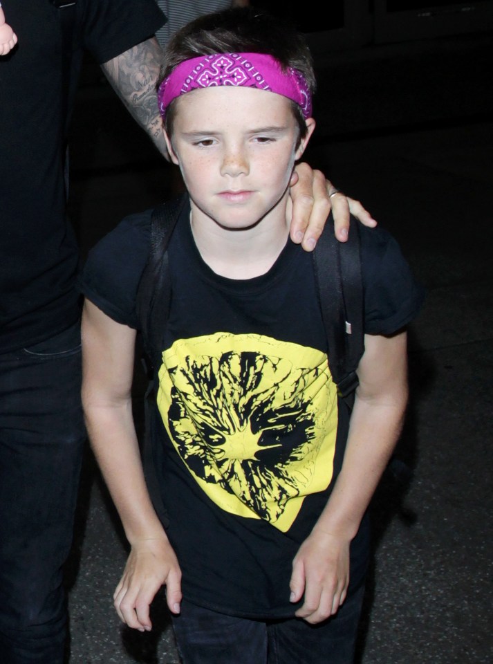 David Beckham and Kids arriving at the Los Angeles International Airport.