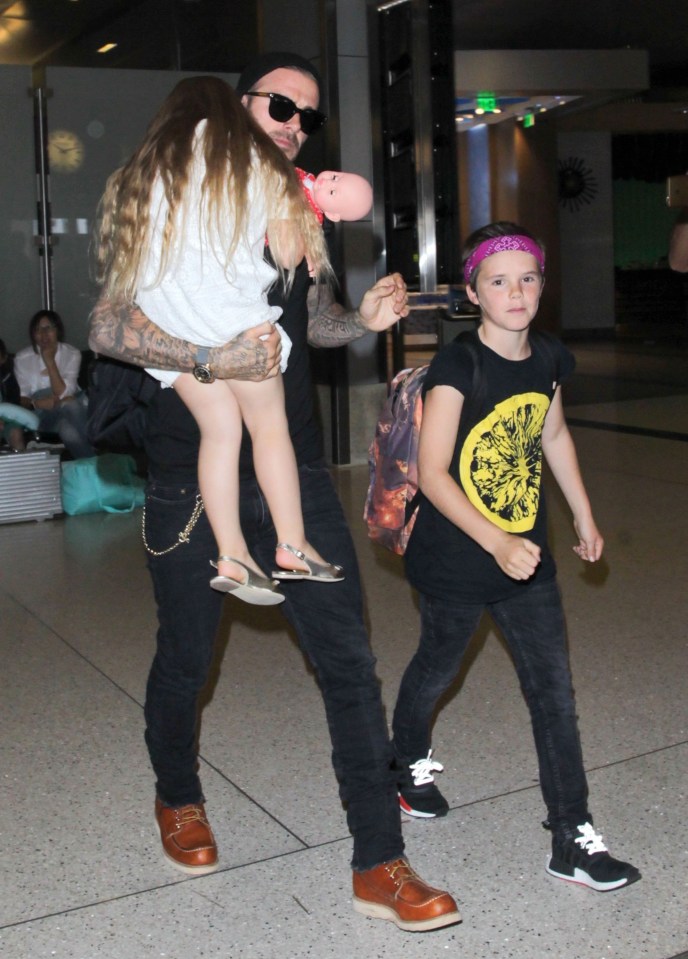 FAMEFLYNET - David Beckham Arriving On A Flight At LAX Airport With Harper And Cruz