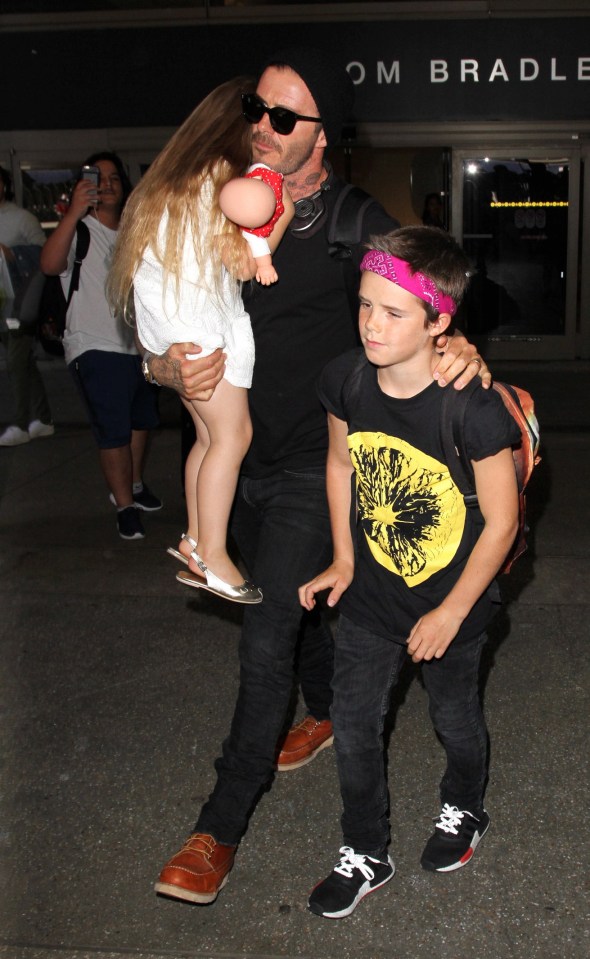 David Beckham has hands full with birthday girl Harper and son Cruz at LAX