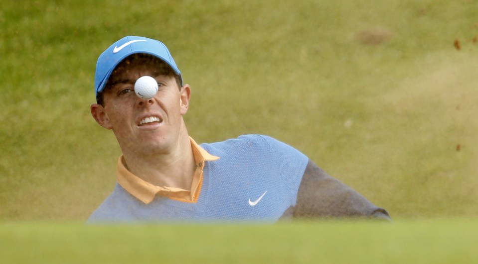  McIlroy plays out of a bunker warming up for The Open