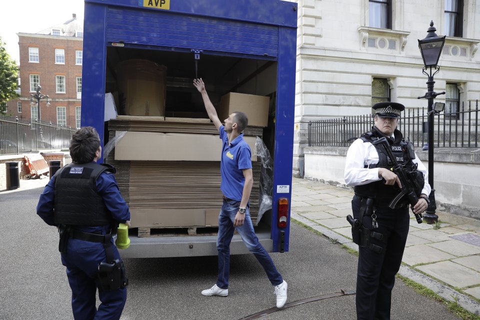  Removal vans have packed up the Cameron's belongings in recent days