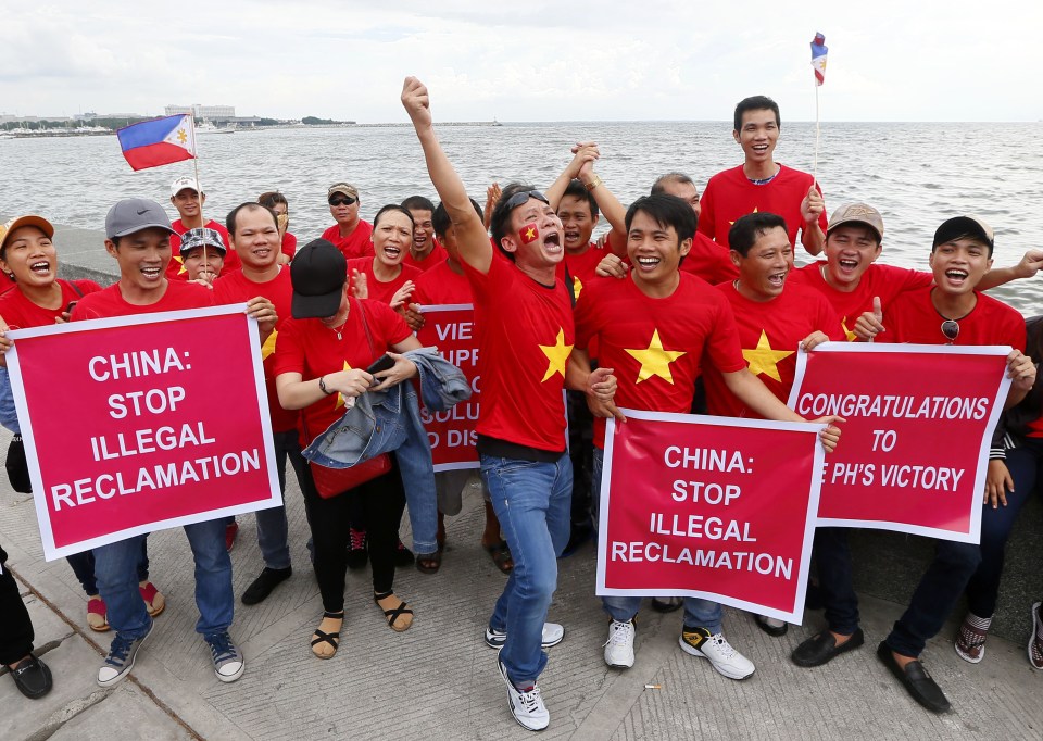  Vietnamese demonstrators cheer as the Hague-based UN international arbitration tribunal last week dismissed CHina's claim to territory in the South China Sea