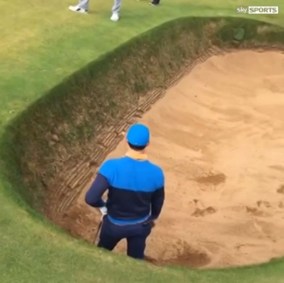  Rory McIlroy takes a look at the shot and how to play it out of the coffin bunker