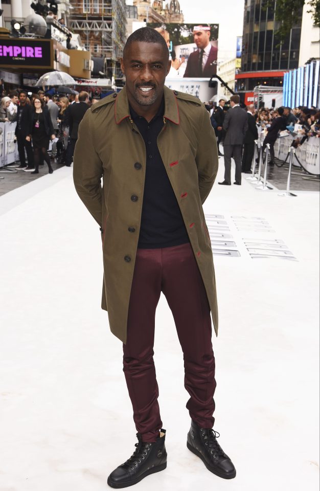  However Idris Elba chose to keep his look casual in a green coat, black top and red trousers