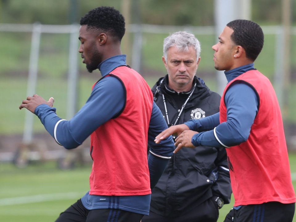  Jose Mourinho keeps close watch as Memphis Depay and Axel Tuanzebe