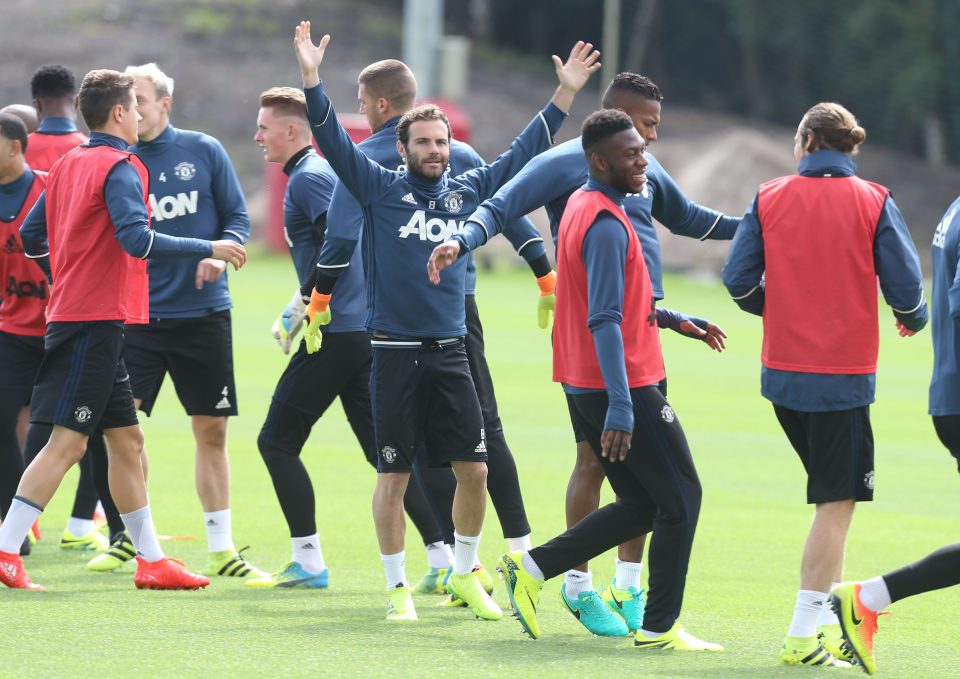  Juan Mata holds his hands in the air during Manchester Uniteds pre-season training at Carrington