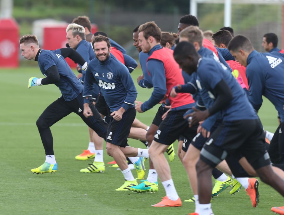  Juan Mata has a laugh as he begins a shuttle run at Carrington