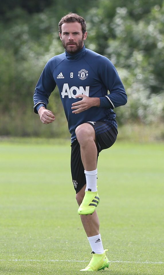  Juan Mata performs his warm-up during pre-season training at Carrington