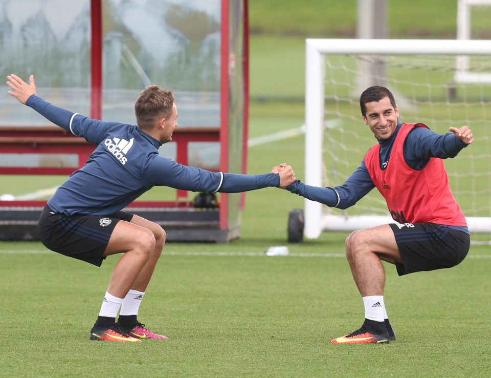  Henrikh Mkhitaryan and Adnan Januzaj stretch together during their first pre-season session