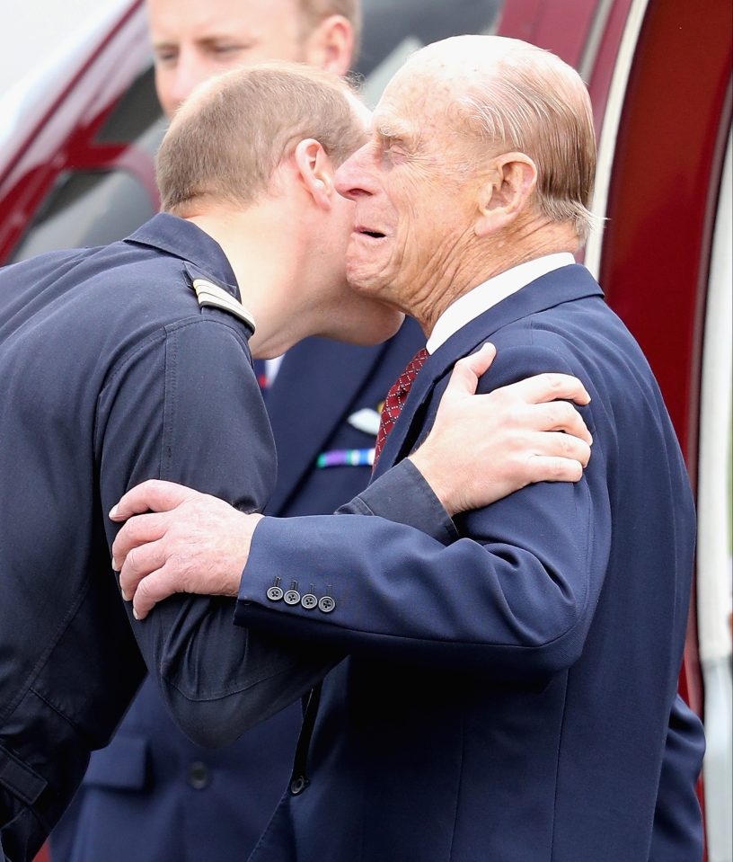  Prince William lands a smacker on his granddad Prince Philip at Cambridge Airport