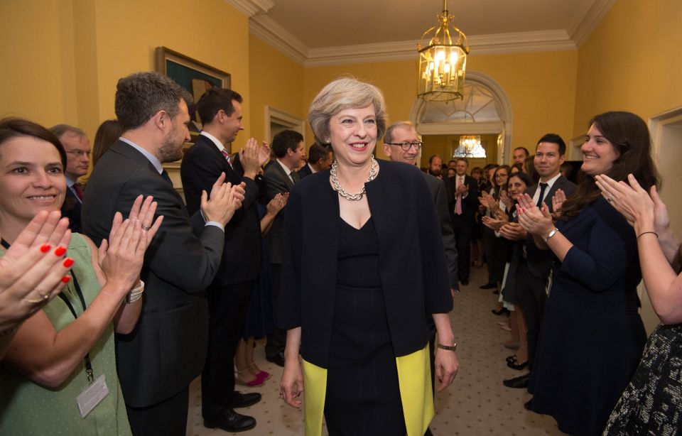  Mrs May was applauded by the No10 staff as she stepped into her new home