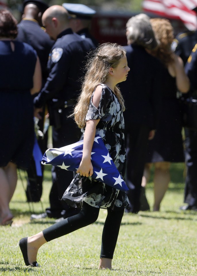  Lorne's daughter Sorcha, 10, pictured holding a U.S flag