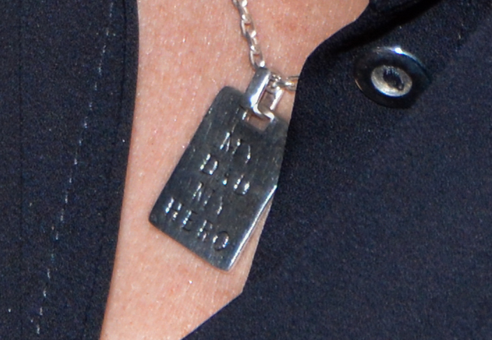  She wore a pendant with the words “My dad my hero” inscribed across it