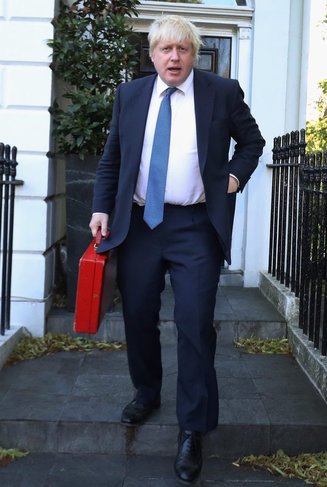  Boris Johnson looks determined as he leaves his home for his first day as Foreign Secretary