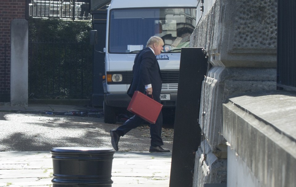  Holding his red ministerial case Britain's new Foreign Secretary Boris Johnson arrives at the back of Downing Street