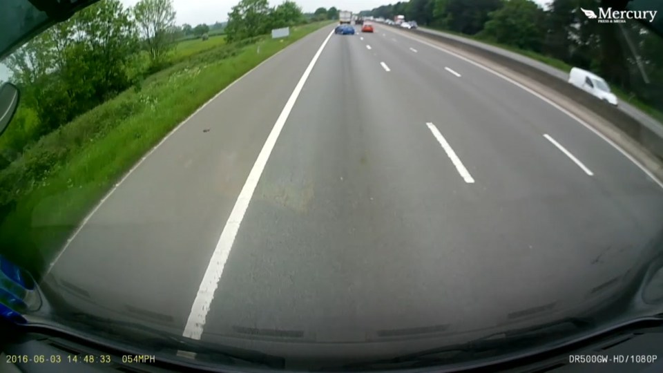  The Peugeot driver steers away at the last second, sending the car out of control