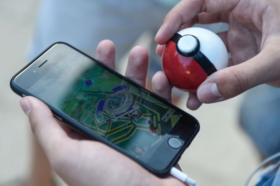  A gamer uses the Pokemon Go application on his smartphone