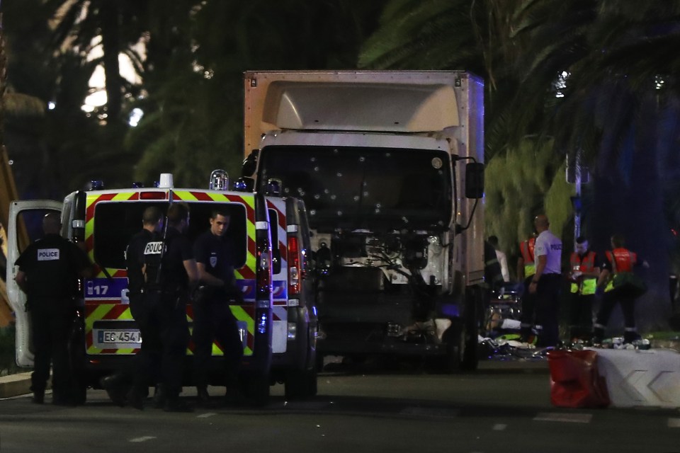 The front of the white lorry appears to be shot up with bullets