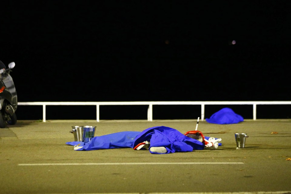  Covered bodies lay on the promenade after the horrific attack last night