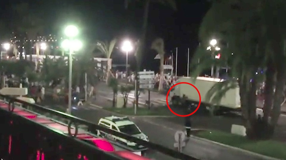  Hero... a motorcyclist can be seen here trying to cling on to the truck as it roared down the promenade