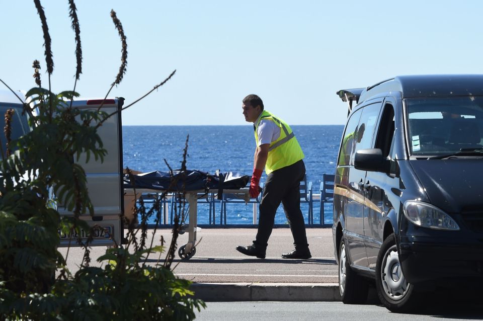  Bodies are removed from the scene of the atrocity in Nice this morning following last's horror attack