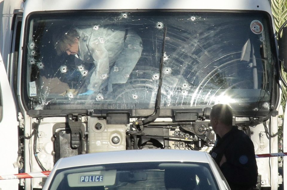  Forensic police investigate the truck that mowed down and killed 84 people in Nice last night