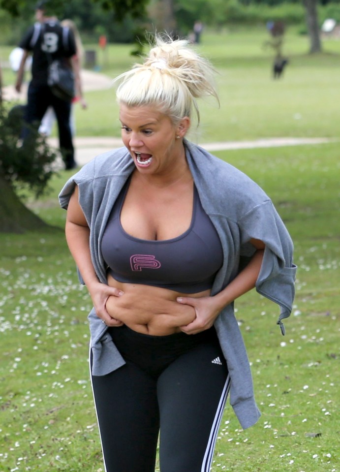 Busting a gut! Kerry Katona was seen grabbing at her stomach on a family day out