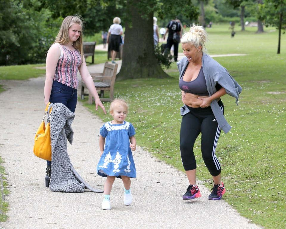 Kerry was seen chasing after her daughter as she pulled at her stomach