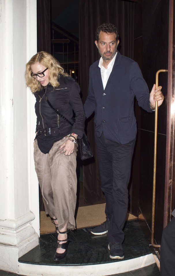  Guy held the door open for Madge as they left the swanky Italian eatery