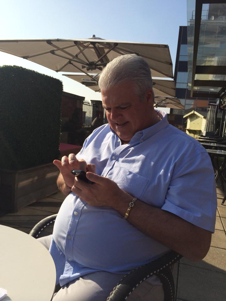  Pot-bellied Adrian Whitehurst suns himself on the terrace of a luxury hotel in Spain in a photo posted on social media